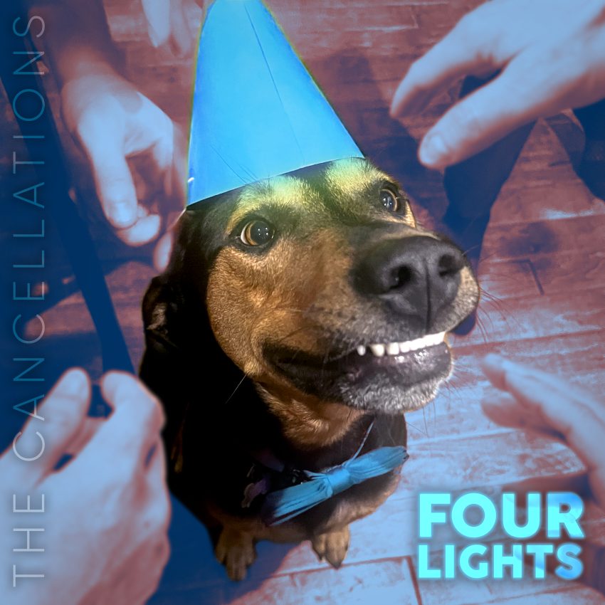 The cover at for The Cancellations' single "Four Lights." It features a smiling black-and-tan dog wearing a bright blue party hat and a blue bowtie.